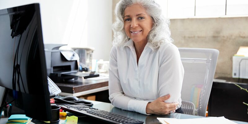 Senior woman at desk