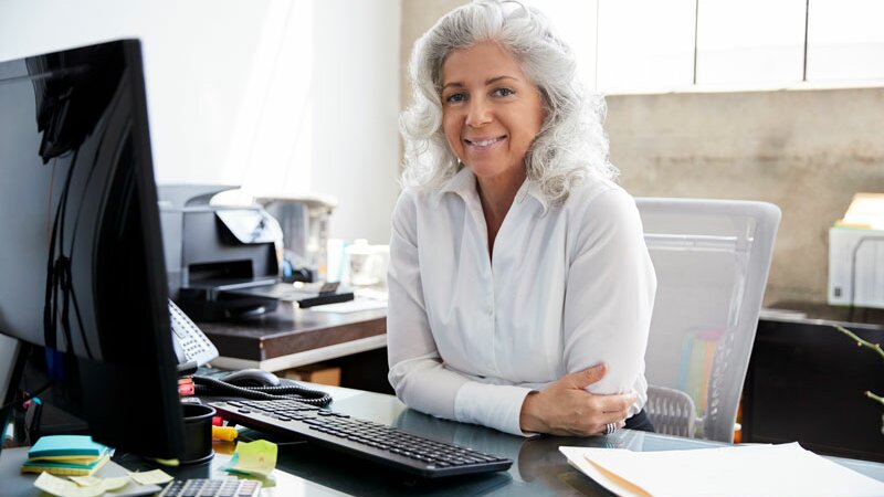 Senior woman at desk
