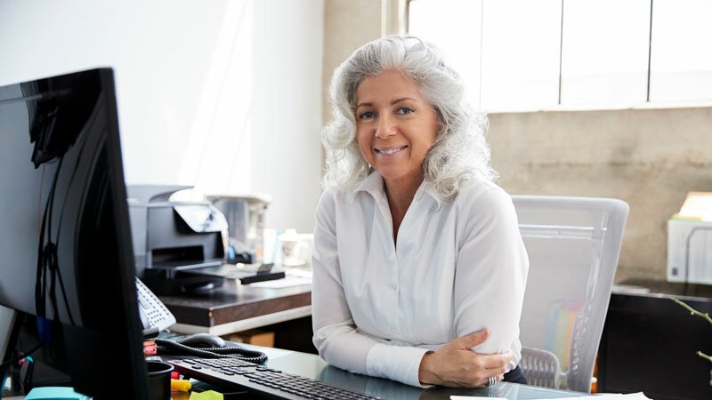 Senior woman at desk