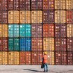 Man standing in front of containers